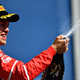 Sebastian Vettel doing a very expensive victory celebration at the Hungarian Grand Prix. Photo credit: Dan Mullan/Getty Images